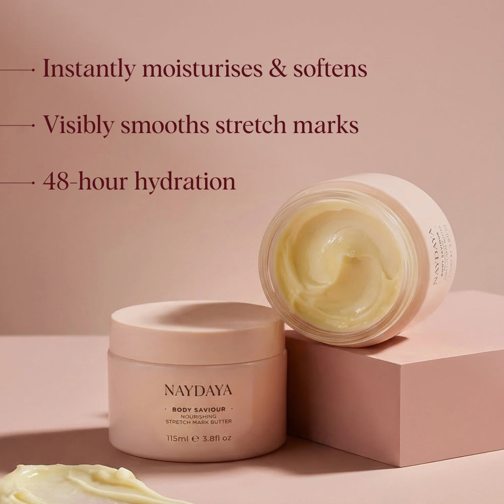 Naydaya Body Savour skin and stretch mark butter in a pale pink jar, shown open with creamy yellow balm beside it on a pink background, with marketing text listing benefits such as visibly smooths stretch marks.