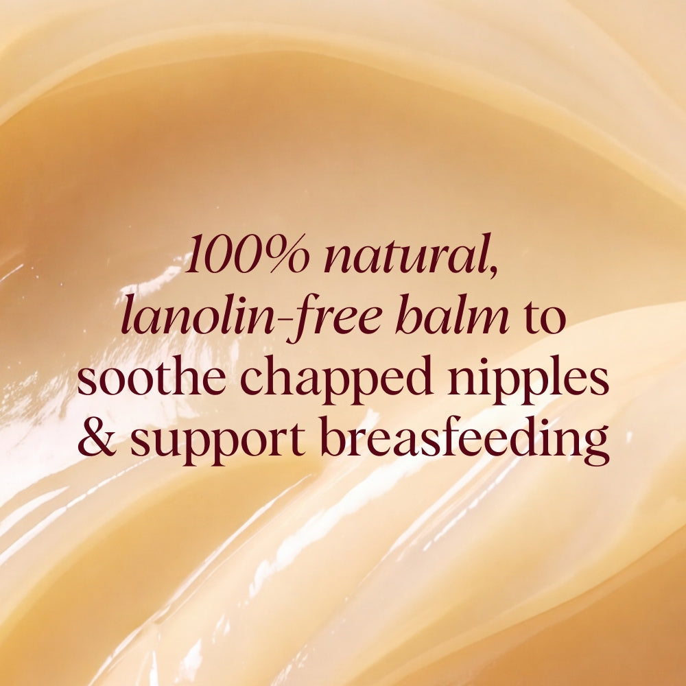 Close-up of a smooth, glossy beige balm texture with dark red text overlay reading: '100% natural, lanolin-free balm to soothe chapped nipples & support breastfeeding'.